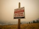 British Columbia's desperate battle against hundreds of wildfires continues on multiple fronts Sunday. A warning sign about fire risk is seen as smoke from wildfires fills the air, in Kelowna, B.C., Saturday, Aug. 19, 2023.