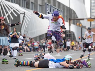 Skaters perform some tricks while thousands of Calgarians celebrate Pride Week with the Calgary Pride Parade in downtown Calgary on Sunday, September 3, 2023.
