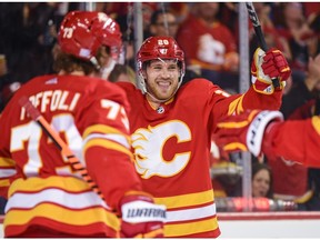 Calgary Flames forward Elias Lindholm celebrates a goal last season with Tyler Toffoli, who was traded to the New Jersey Devils in June.