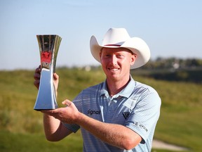 Hayden Springer holds the trophy after winning the Fortinet Cup Championship at Country Hills Golf Club in Calgary on Sunday, Sept. 10, 2023.