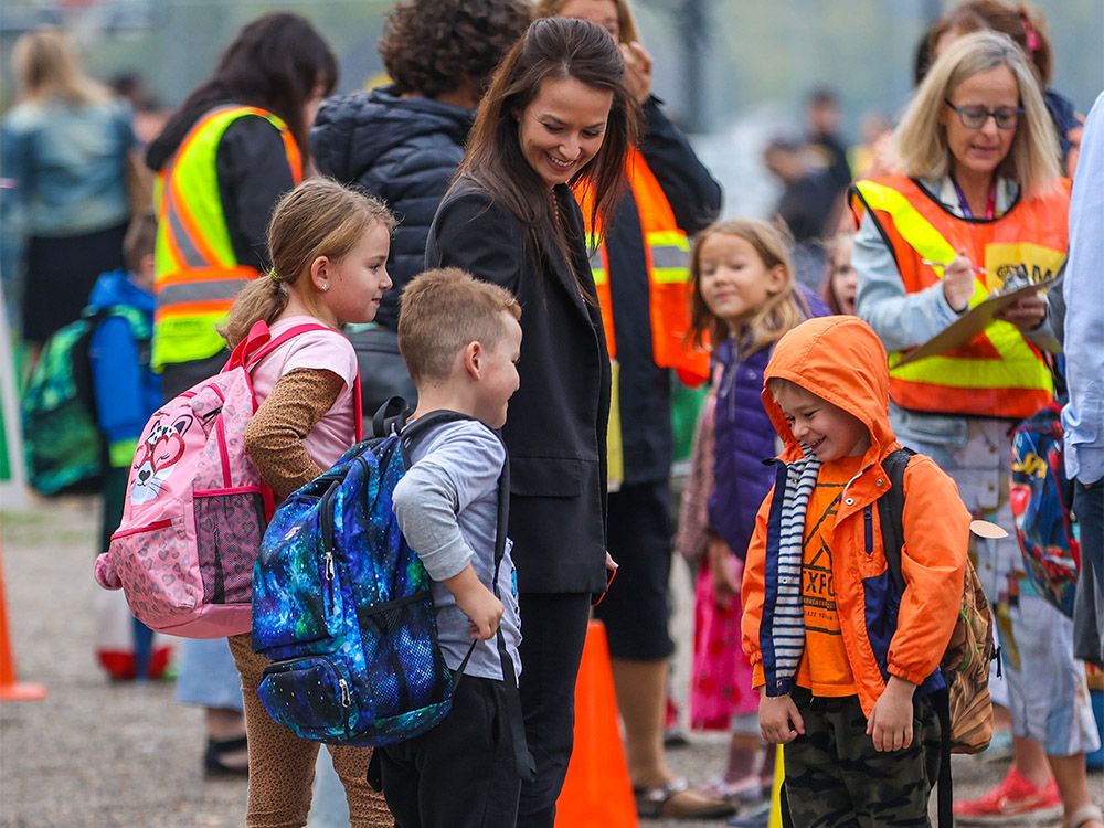 FILE PHOTO: Kids, parents and teachers gather on the first day of classes for Calgary public schools on Thursday, August 31, 2023.