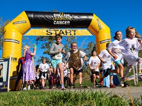 Kids race off the start in the Run To End Childhood Cancer in Eau Claire on Saturday, September 16, 2023. The event, celebrating its 10th anniversary, started in 2013 as a legacy of Jacey Uphill, who passed away from Ewing sarcoma in October 2012.