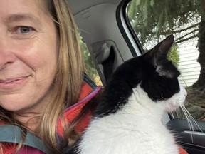 Elizabeth Wilkins holds her cat Leo in Juneau, Alaska, on August 3, 2023.