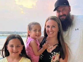 Ashley Summers, pictured with her husband and daughters, died on the July 4 weekend after consuming too much water.