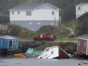 Buildings sit in the water along the shore following hurricane Fiona in Rose Blanche-Harbour Le Cou, Newfoundland on Tuesday September 27, 2022.