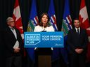 Flanked by Nate Horner, President of Treasury Board and Alberta Minister of Finance and Jim Dinning, chair of the Alberta Pension Plan Report Engagement Panel, Premier Danielle Smith announces the release of an independent report on a potential Alberta Pension Plan on Thursday, Sept. 21.