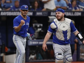 Toronto Blue Jays relief pitcher Jordan Hicks pumps his fist as catcher Alejandro Kirk looks on after the Jays defeated the Tampa Bay Rays during a baseball game, Sunday, Sept. 24, 2023, in St. Petersburg, Fla. The Blue Jays' post-season fate will be determined this week. Toronto will host the New York Yankees and Tampa Bay Rays in a six-game homestand starting Tuesday.