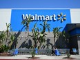 In this file photo taken on Aug. 15, 2022, the Walmart logo is seen outside a Walmart store in Burbank, Calif.