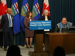 Health Minister Adriana LaGrange with Drs. Noel DaCunha, Janet Reynolds and Tyler White