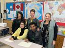 LEAD teachers (L-R back row) Aliya Haji, Ellen Braaten and Carla Belanger with students Zulekha Sediq (L) and Aman Gebreheit at Forest Lawn High School.