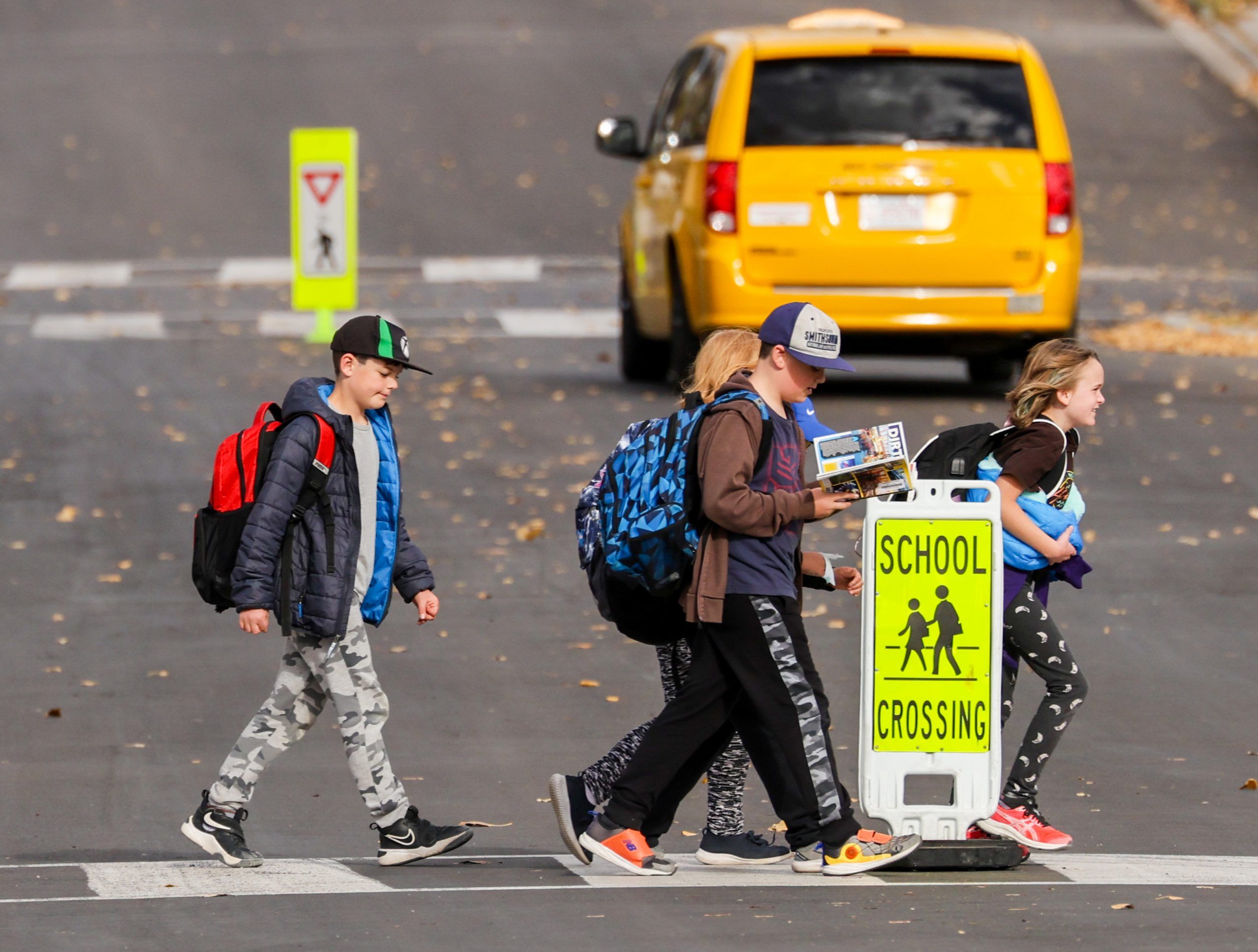 City of Calgary installing in street crosswalk signs to improve safety