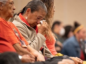 Family members listen during a news conference about victims who died in a mass stabbing at James Smith Cree Nation in Saskatchewan, September 6, 2022.