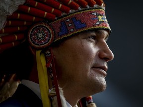 Manitoba Premier Wab Kinew speaks at a swearing-in ceremony in Winnipeg, Wednesday, Oct. 18, 2023. Kinew is set to meet with the families of two slain First Nations women whose remains are believed to be in a Winnipeg-area landfill.