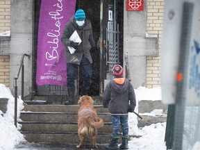 A man comes out of the Rosemont public library in Montreal during the pandemic. A new bylaw would allow libraries to evict or fine those with "personal hygiene" issues.