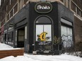 The boarded up storefront of the Shaika coffee shop is seen in Montreal on March 7.