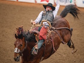 Logan Hay of Wildwood, Alta., scored 87.50 on One More Reason to win Saddle Bronco at the Calgary Stampede Rodeo on Monday, July 10, 2023. Mike Drew/Postmedia