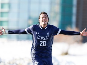 Miguel Da Rocha celebrates his overtime goal, leading the Mount Royal University Cougars mens soccer team to a 3-1 overtime win over the University of Victoria in the Canada West semifinal. Credit: Daniel Zappe