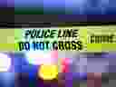 Crime scene tape is illuminated by police lights in Calgary in this file illustration.