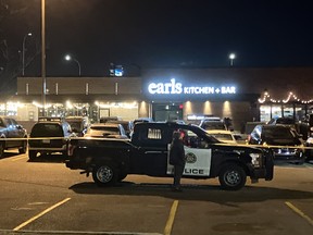 Police cordoned off a parking lot outside an Earls restaurant in southeast Calgary for much of the evening following a shooting on Saturday, Nov. 23, 2023.