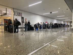 An image of a security lineup in Calgary International Airport.