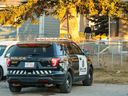 Calgary police guard a home in Dover, one of two that were surrounded by crime scene tape along 30 Avenue S.E. on Tuesday, November 14, 2023. 
