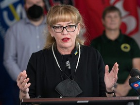 United Nurses of Alberta president Heather Smith takes part in a news conference where Alberta's health-care unions advocated that the government take steps to fully address the staffing crisis in health care on Oct. 24, 2022.