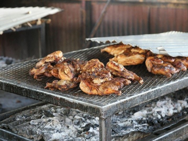  Jamaica’s famous jerk chicken grilling over hot coals. Courtesy, Jamaican Tourist Board