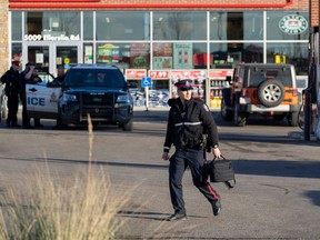 Police investigate the scene of of what they describe as a "serious, targeted incident" at 52 Street SW and Ellerslie Road near a gas station on Thursday, Nov. 9, 2023 in Edmonton.