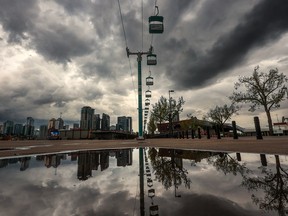A threatening sky looms over downtown Calgary and Stampede Park on May 8, 2023.
