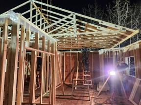 Construction workers worked early into the morning of Saturday, Dec. 16 as part of a 72-hour blitz to rebuild a Cremona family’s home after an August fire.