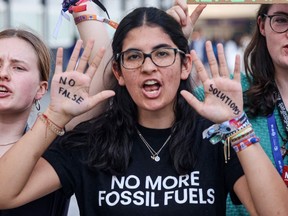 Climate activists protest against fossil fuels on the sidelines of the COP28 United Nations climate summit in Dubai on December 5, 2023.