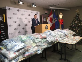 Evidence of a money laundering operation, including the illegal manufacturing and sale of anabolic steroids, is pictured at Calgary police headquarters