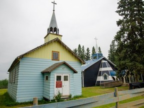 The original St. Gabriel Catholic Mission, left, in Janvier, Alta. on July 19, 2021.