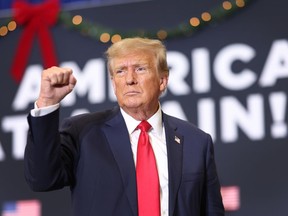 Republican presidential candidate and former U.S. President Donald Trump gestures as he wraps up a campaign event on Dec. 19, 2023 in Waterloo, Iowa.