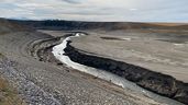 The Oldman Reservoir, with a silt plain with the river running through it.