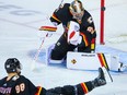 A Minnesota Wild shot gets past Calgary Flames goaltender Dan Vladar at Scotiabank Saddledome in Calgary on Tuesday, Dec. 5, 2023.