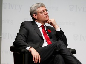 FILE: Stephen Harper attends an event in Toronto hosted by the Ivey School of Business, University of Western Ontario, on November 8, 2013.