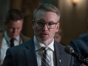 Minister of Health Everett Hindley answers questions from the press after question period at the Saskatchewan Legislative Building on Thursday, Oct. 12, 2023 in Regina.