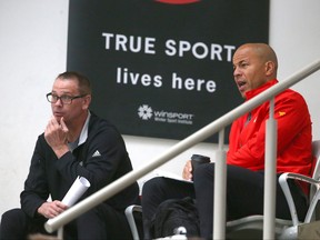 Craig Conroy (left) and Jarome Iginla chat and look on during Calgary Flames development camp.