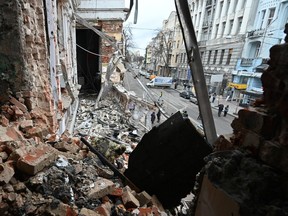 This photograph taken on December 31, 2023 shows a heavily damaged building following an early morning Russian drone attack in Kharkiv.