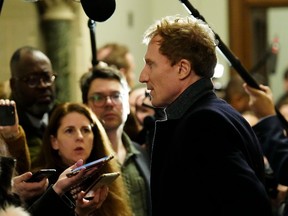 Immigration, Refugees and Citizenship Minister Marc Miller speaks to reporters as he arrives to a caucus meeting on Parliament Hill in Ottawa on Wednesday, Jan. 31, 2024.