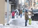 Pedestrians walk in downtown Calgary on Monday, January 15, 2024. The sidewalks were noticeably busier than the week prior with the jump in temperature from around -30 C to -15.