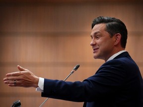 Conservative Leader Pierre Poilievre address the national Conservative caucus on Parliament Hill in Ottawa on Sunday, Jan. 28, 2024.