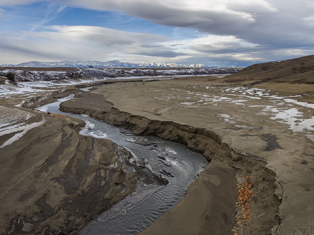 The Oldman River flows into the nearly-dry Oldman Reservoir north of Cowley on Dec. 18.