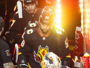 Calgary Flames defenceman Oliver Kylington hits the ice for warm up before the game against the Columbus Blue Jackets at the Saddledome on Thursday