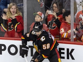 Calgary Flames defenceman Oliver Kylington hits the ice for warm up before the game against the Columbus Blue Jackets at the Saddledome on Thursday