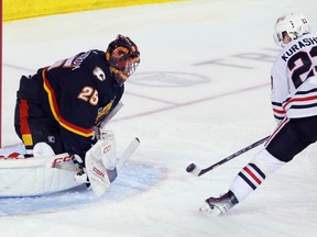 Calgary Flames goalie Jacob Markstrom, makes a save against Chicago Blackhawks' Philipp Kurashev during second period NHL hockey action in Calgary