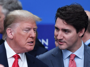 U.S. President Donald Trump talks with Prime Minister Justin Trudeau during the NATO summit near London, Dec. 4, 2019.
