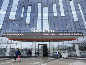 A person leaves Sheridan College's Hazel McCallion Campus in Mississauga, Ont., on Friday, Jan. 26, 2024.