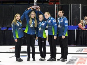 Skip Selena Sturmay, third Danielle Schmiemann, second Dezaray Hawes, lead Paige Papley and coach Ted Appelman celebrate winning the Alberta Scotties Tournament of Hearts